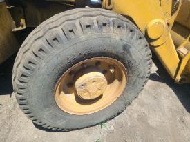 CAT 416D Right/Passenger Tire and Rim - Used