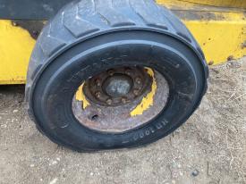 New Holland L185 Left/Driver Tire and Rim - Used