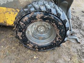 New Holland L228 Right/Passenger Tire and Rim - Used