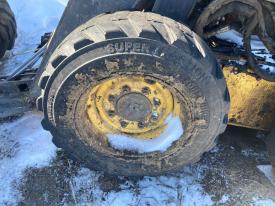 New Holland L175 Left/Driver Tire and Rim - Used