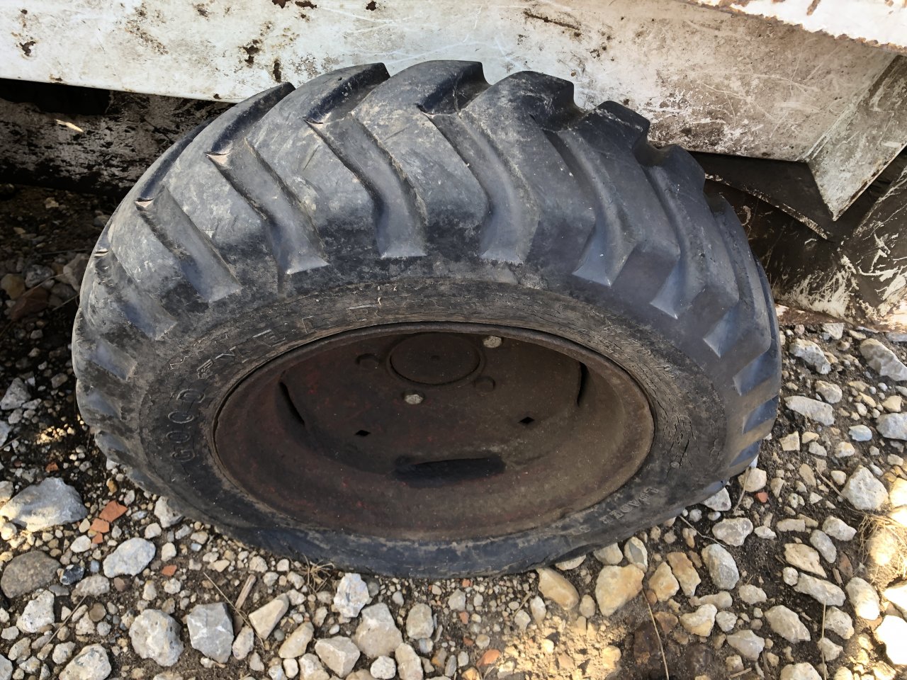 Bobcat M371 Tire and Rim