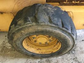 New Holland LX865 Left/Driver Tire and Rim - Used