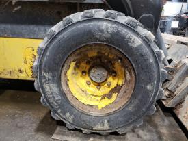 New Holland L225 Right/Passenger Tire and Rim - Used