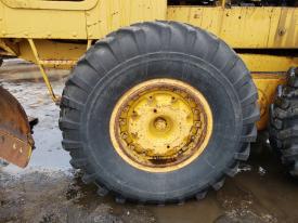 CAT 120 Left/Driver Tire and Rim - Used