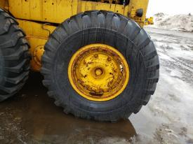 CAT 120 Left/Driver Tire and Rim - Used