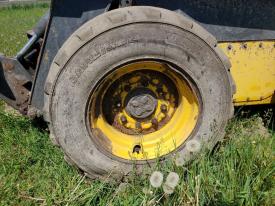 New Holland LS185B Left/Driver Tire and Rim - Used