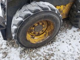 New Holland L170 Left/Driver Tire and Rim - Used