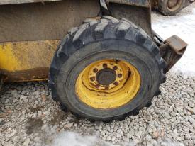 New Holland LS185B Right/Passenger Tire and Rim - Used
