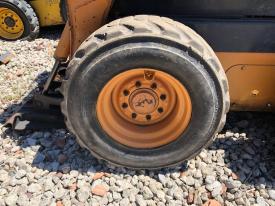 Case SR175 Left/Driver Tire and Rim - Used