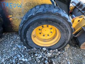 John Deere 324E Right/Passenger Tire and Rim - Used | P/N KV11921
