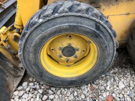 Gehl 4625SX Left/Driver Tire and Rim - Used