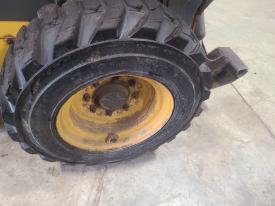 New Holland L225 Left/Driver Tire and Rim - Used