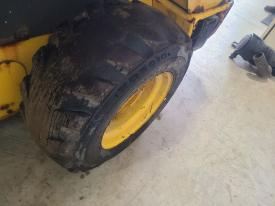 New Holland L225 Right/Passenger Tire and Rim - Used