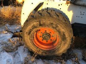 Bobcat 863 Left/Driver Tire and Rim - Used