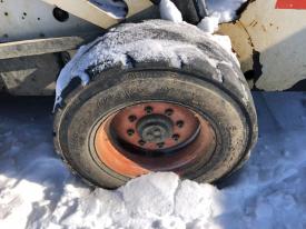 Bobcat 883 Left/Driver Tire and Rim - Used