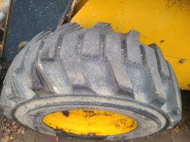 John Deere 326D Tire and Rim - Used