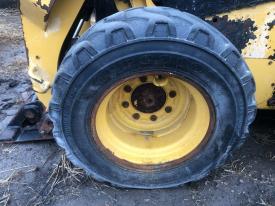 CAT 226D Left/Driver Tire and Rim - Used