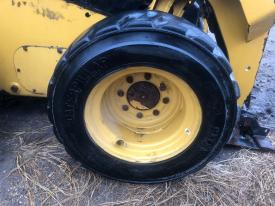 CAT 226D Right/Passenger Tire and Rim - Used