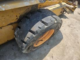 New Holland LX865 Left/Driver Tire and Rim - Used