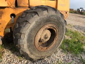 Case 821 Left/Driver Tire and Rim - Used
