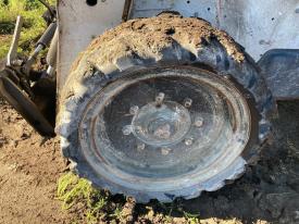 Bobcat S770 Left/Driver Tire and Rim - Used