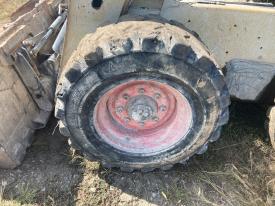 Bobcat S650 Left/Driver Tire and Rim - Used