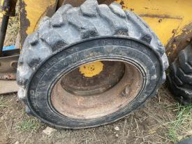 Gehl 4635SX Left/Driver Tire and Rim - Used