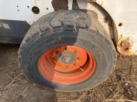 Bobcat S185 Left/Driver Tire and Rim - Used