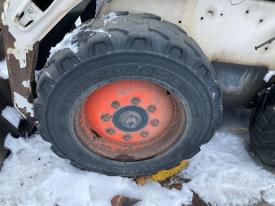 Bobcat S185 Left/Driver Tire and Rim - Used