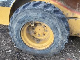 CAT 252B3 Right/Passenger Tire and Rim - Used