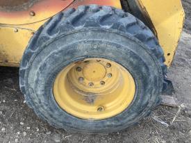 CAT 252B3 Right/Passenger Tire and Rim - Used