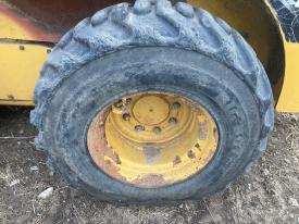 CAT 252B3 Left/Driver Tire and Rim - Used