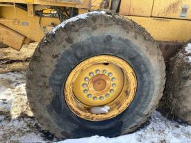 John Deere 770BH Left/Driver Tire and Rim - Used