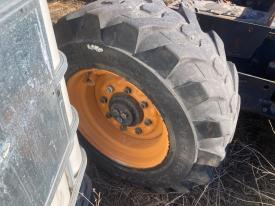 Bobcat S220 Left/Driver Tire and Rim - Used