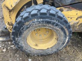 CAT 262D3 Left/Driver Tire and Rim - Used
