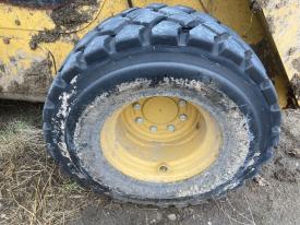 CAT 262D3 Left/Driver Tire and Rim - Used