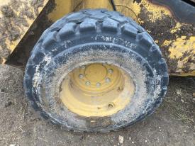 CAT 262D3 Right/Passenger Tire and Rim - Used