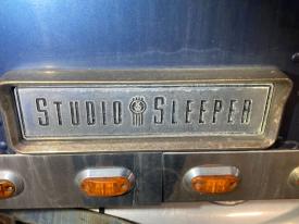 Kenworth W900L Cab, Misc. Parts Studio Sleeper Emblem W/ Bezel Surround
