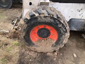 Bobcat S740 Left/Driver Tire and Rim - Used