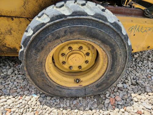 1999 New Holland LX885 Left Tire And Rim