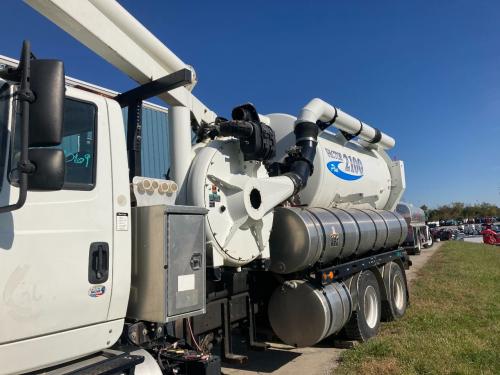 Vactor 2100 Plus, Model # 2110-J6-Plus  Unit Only As Is, With Tanks And Tool Box, Missing Multiple Hoses Right Side Of Main Tank Is Scratched And Scuffed, With Front Reel, Front Reel Missing The Front Panel, Side Controls Disconnected Sitting On Top Of Fr