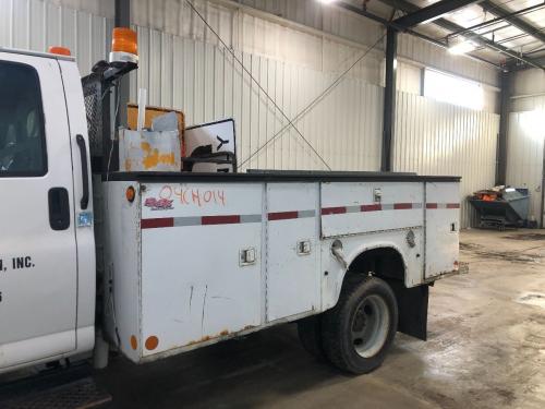 Utilitybody | Length: 11'5" | 11'5" Utility Body With  Storage Boxes W/Doors, Body Shows Light Rust
front Of Box To Center Of Wheel Well Measures (82")