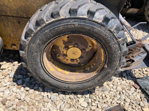 2000 New Holland LS140 Right Tire And Rim