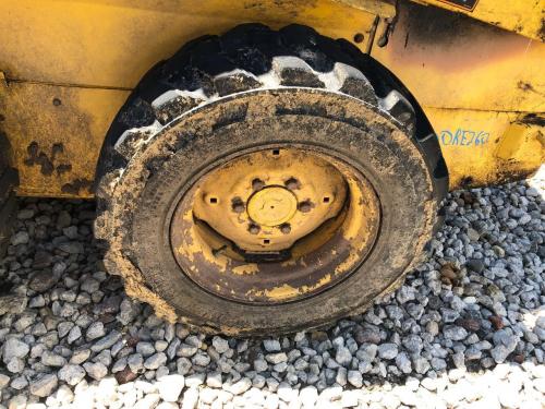 2000 New Holland LS140 Left Tire And Rim