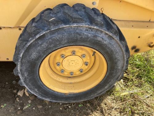 1999 New Holland LX565 Left Tire And Rim: P/N 2147165