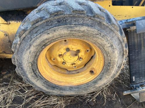 1987 New Holland L553 Left Tire And Rim