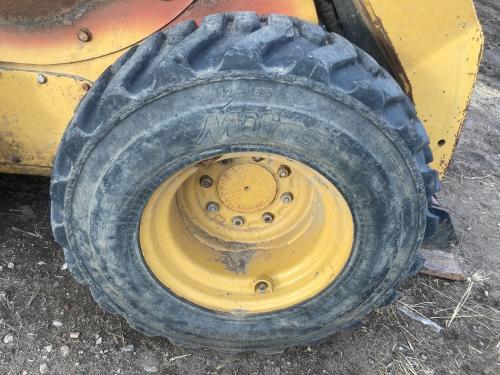 2013 Cat 252B3 Right Tire And Rim